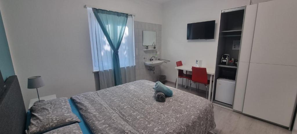 Voodi või voodid majutusasutuse 7ROOMS Grancia toas