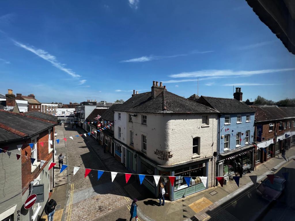 an overhead view of a city with flags and buildings at The Farthings, Romsey Apartment in Romsey