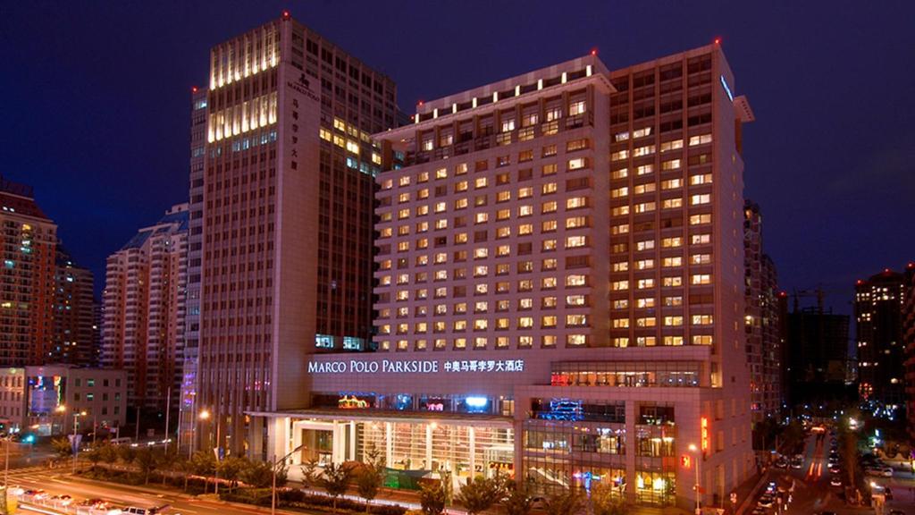 a large building in a city at night at Marco Polo Parkside, Beijing in Beijing