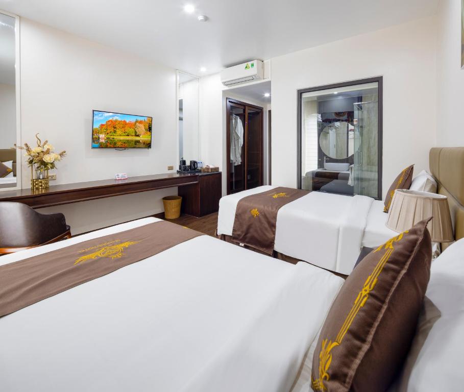Postel nebo postele na pokoji v ubytování Diamond Luxury Hotel