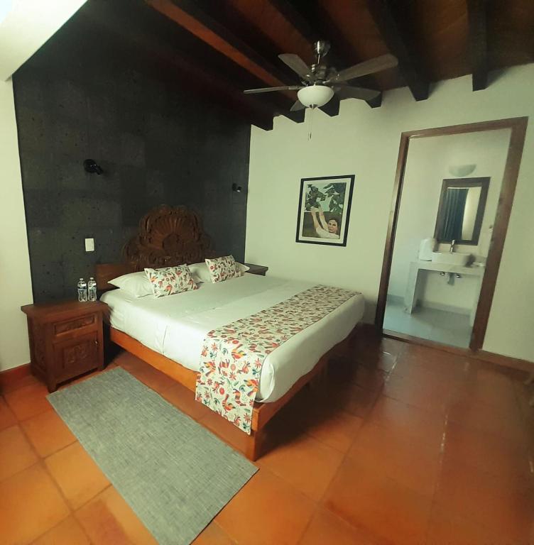 Postel nebo postele na pokoji v ubytování Hotel La Lejona
