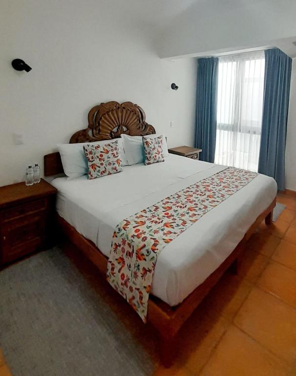 Postel nebo postele na pokoji v ubytování Hotel La Lejona