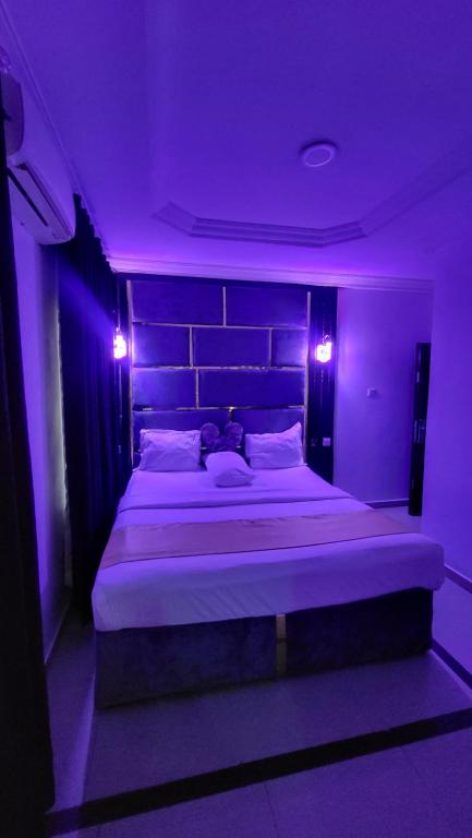 Postel nebo postele na pokoji v ubytování Palazzo Apartments