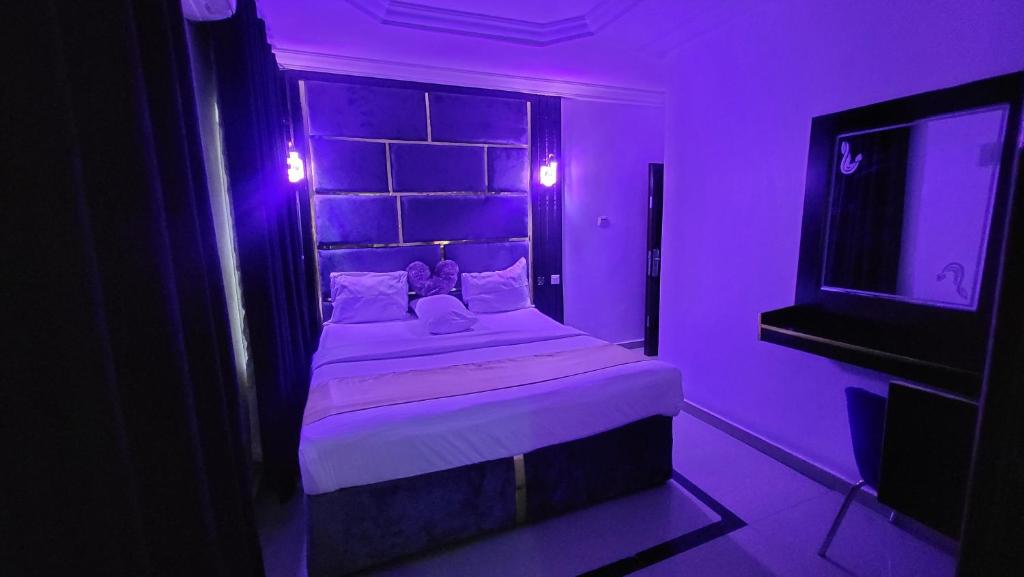 Postel nebo postele na pokoji v ubytování Palazzo Apartments