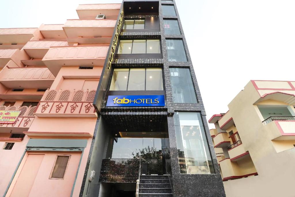 a building with a sign on the side of it at FabHotel Lemon Grass - Assi Ghat in Varanasi
