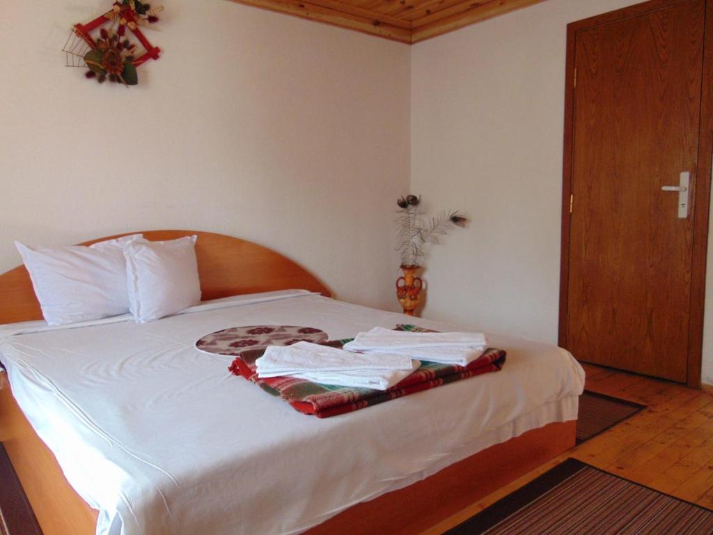 Postel nebo postele na pokoji v ubytování Sarafova Guest House