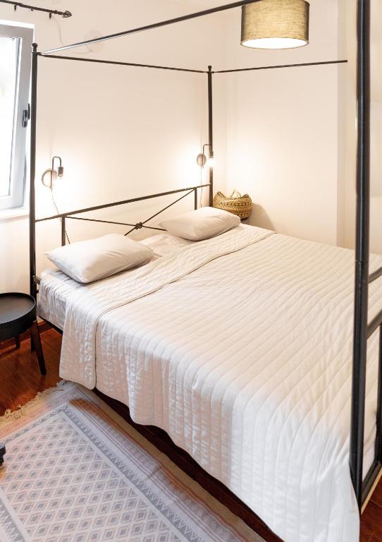 Postel nebo postele na pokoji v ubytování Apartments Castello Risano