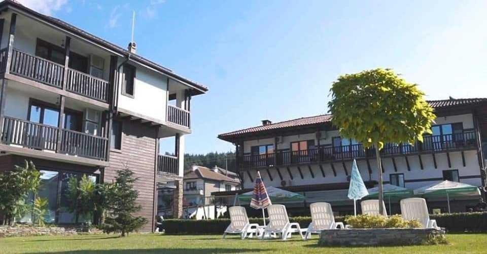 a group of chairs in front of a building at Veykata Resort & Spa in Chakalarovo