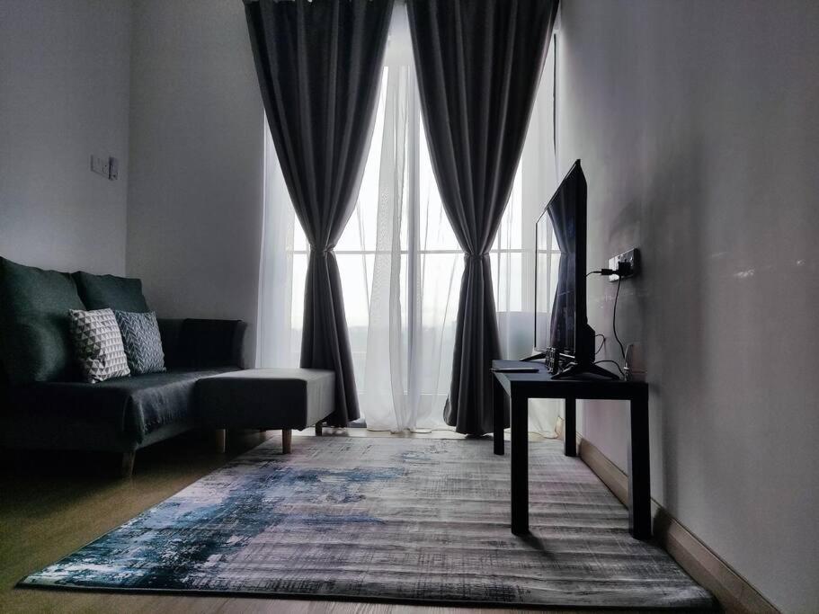 a living room with a couch and a window at The Grand SS15 2BRs Infinity Pool 100Mbps WiFi in Subang Jaya