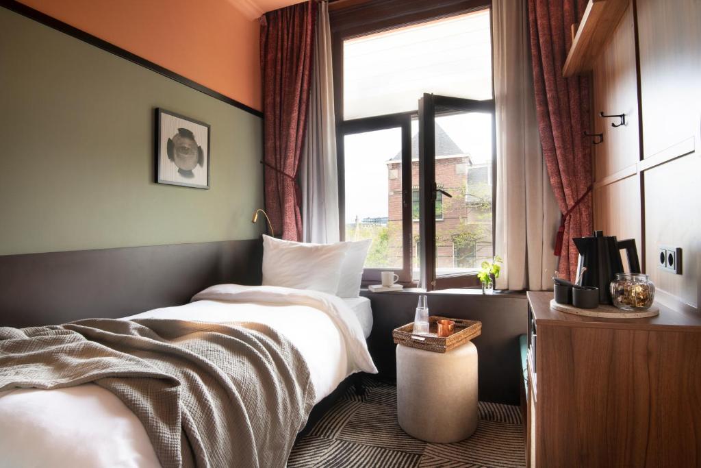 Postel nebo postele na pokoji v ubytování Jan Luyken Amsterdam
