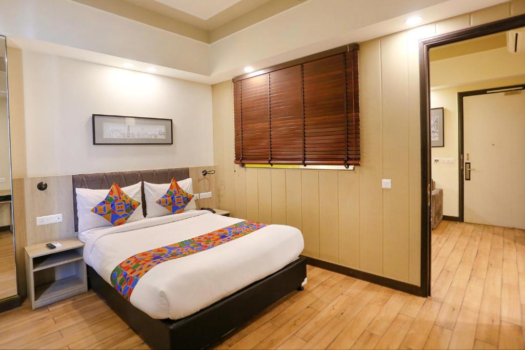 Postel nebo postele na pokoji v ubytování FabHotel Sapphire 83