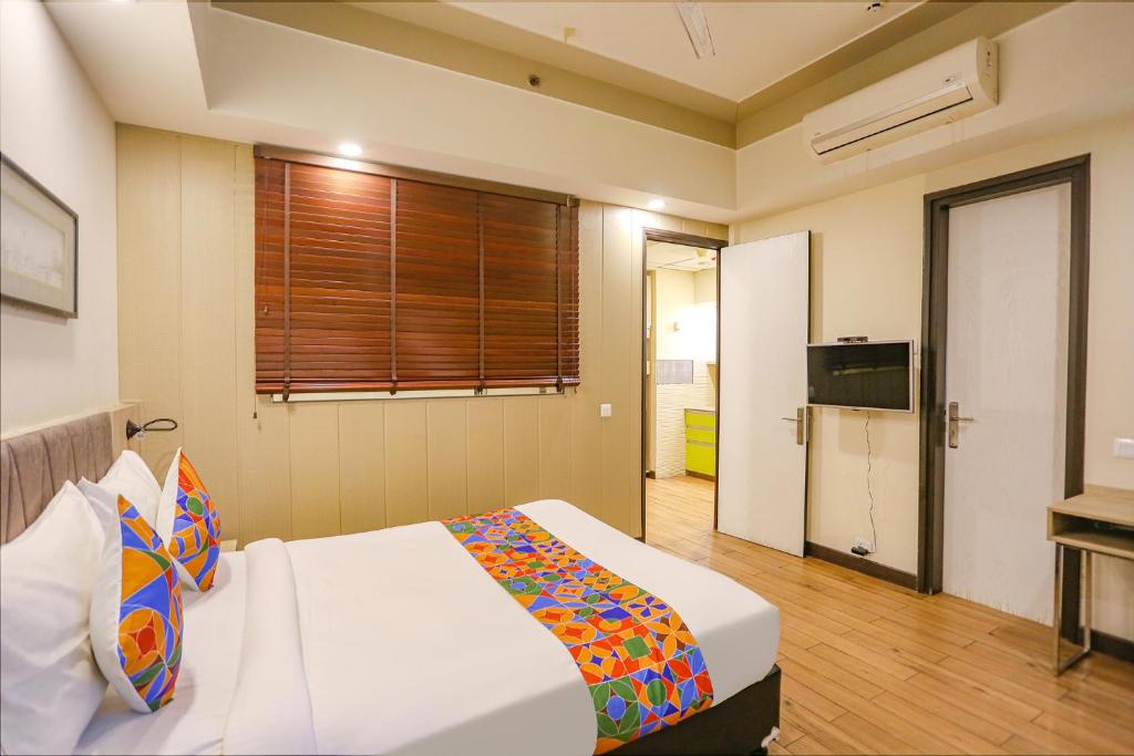 Postel nebo postele na pokoji v ubytování FabHotel Sapphire 83
