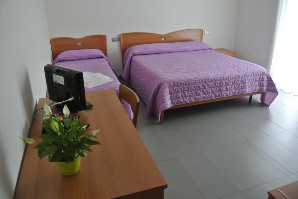 Łóżko lub łóżka w pokoju w obiekcie 7venti