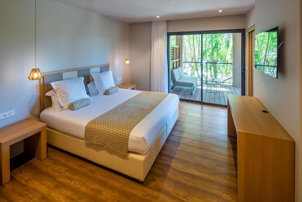 Postel nebo postele na pokoji v ubytování Hotel Restaurant Mariosa