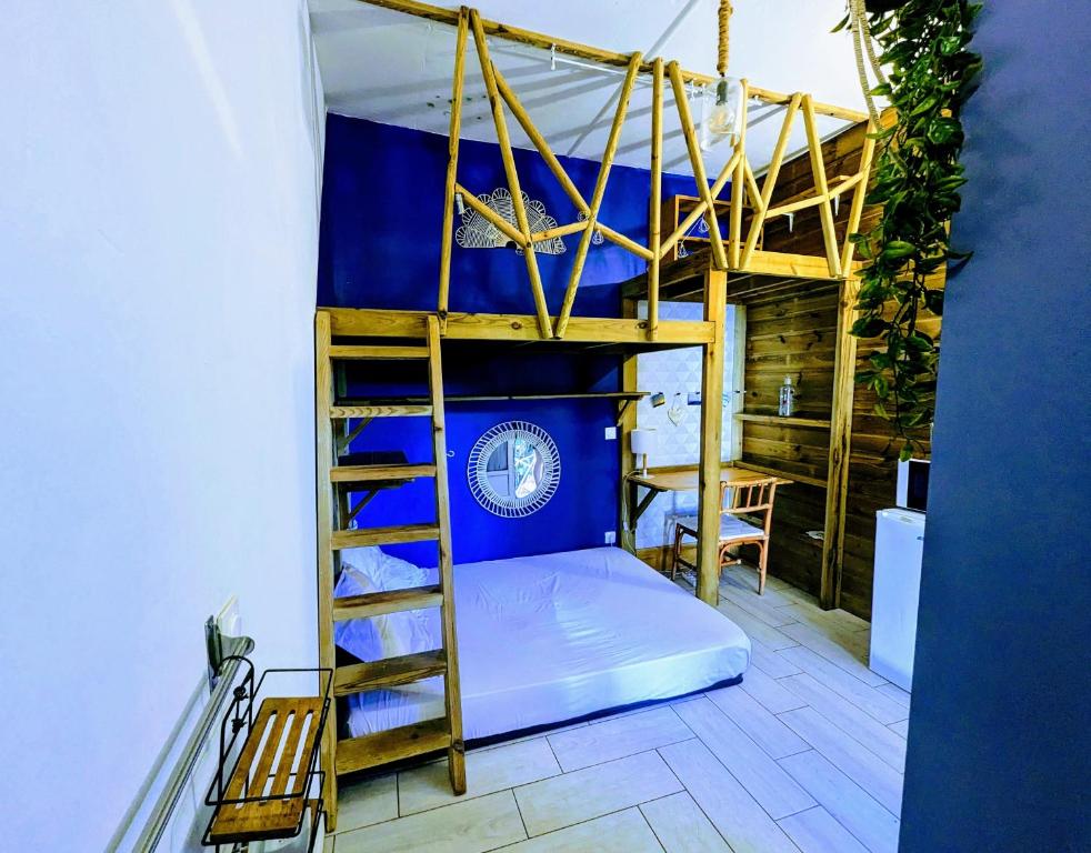 Postel nebo postele na pokoji v ubytování Au geko bleu
