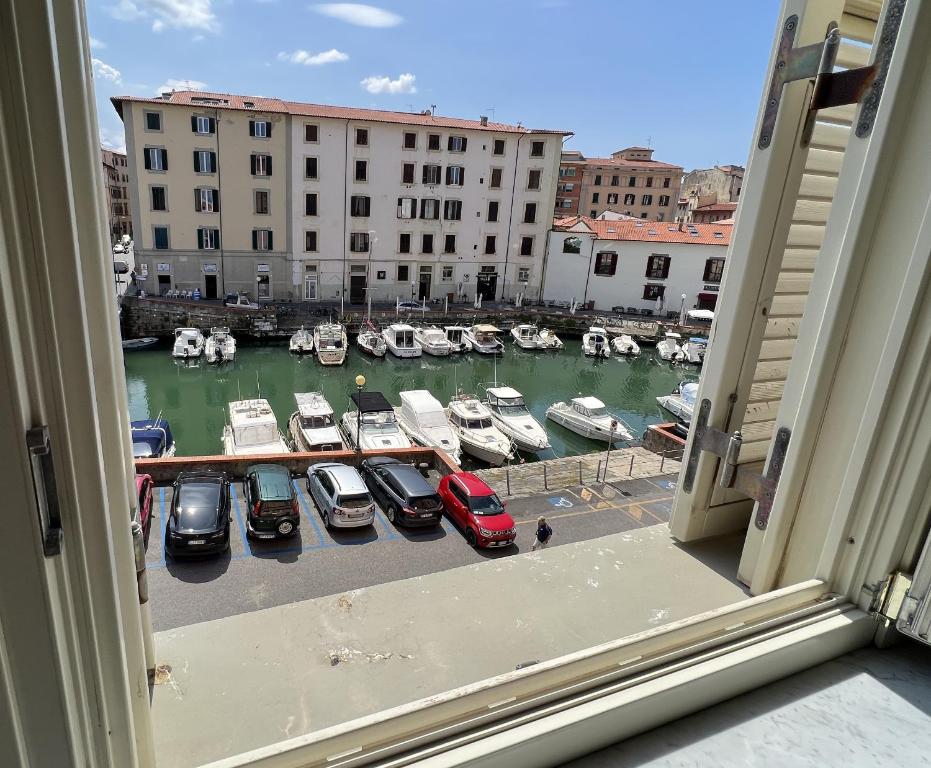 a view from a window of a marina with boats at La Suite di Chiara in Livorno