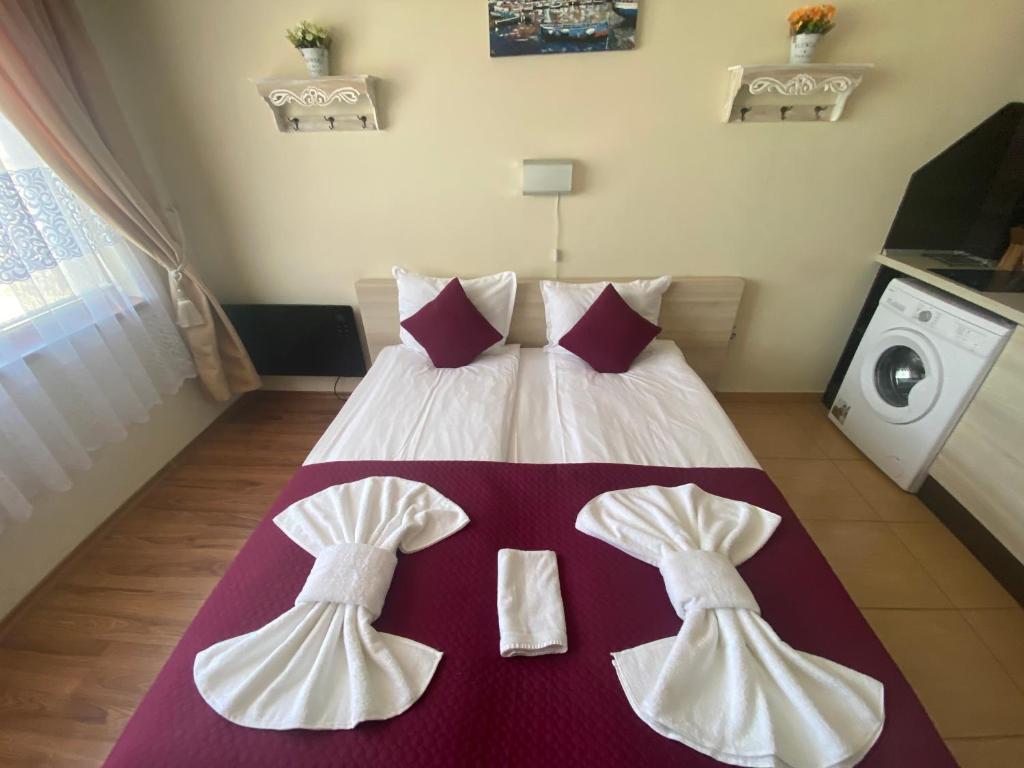 A bed or beds in a room at SUMMER BREEZE 406 Studio Sunny Beach