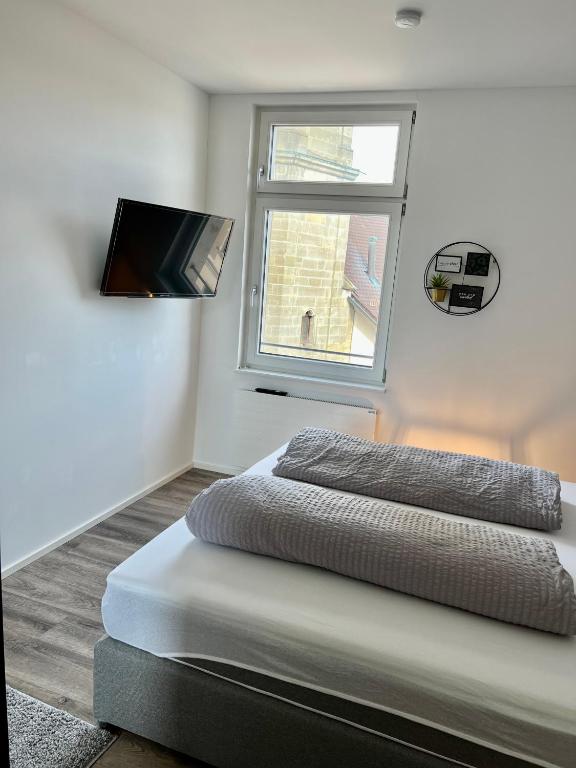 Postel nebo postele na pokoji v ubytování Penthouse im Zentrum von Bregenz
