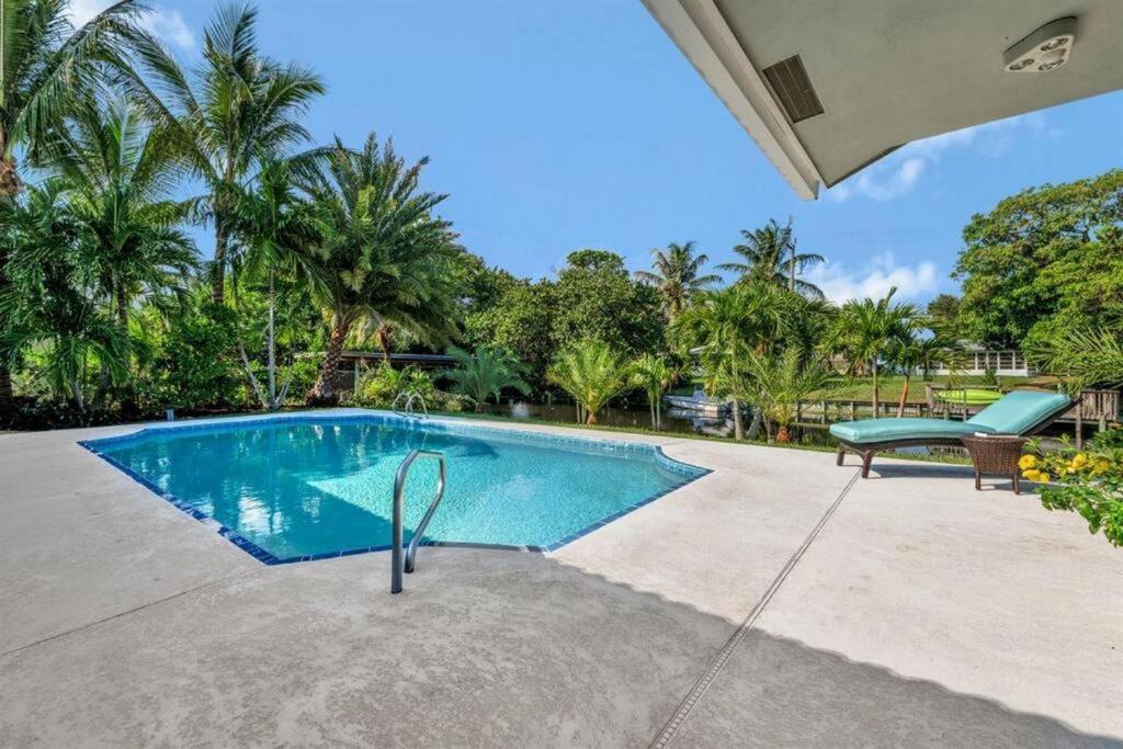 an image of a swimming pool in a house at Waterfront Oasis w/ Pool Minutes to Downtown! in Boynton Beach