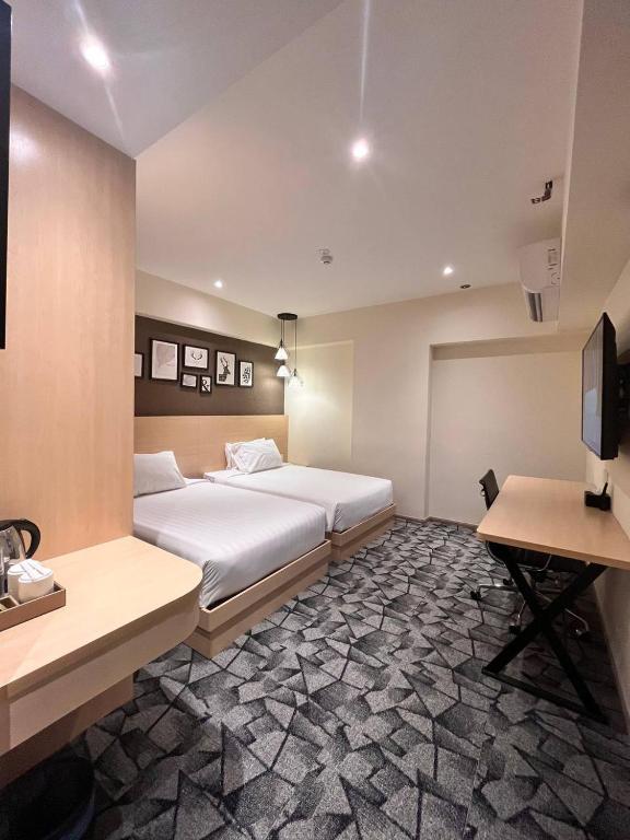 Postel nebo postele na pokoji v ubytování Hotel Damai Kuala Lumpur