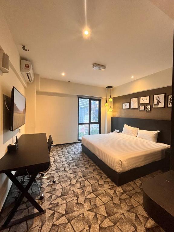 Postel nebo postele na pokoji v ubytování Hotel Damai Kuala Lumpur