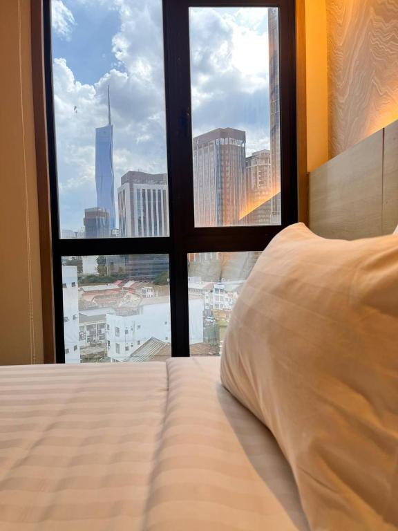 Postel nebo postele na pokoji v ubytování Hotel Damai Kuala Lumpur