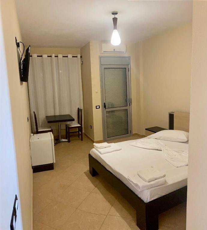 Postel nebo postele na pokoji v ubytování AL Hotel
