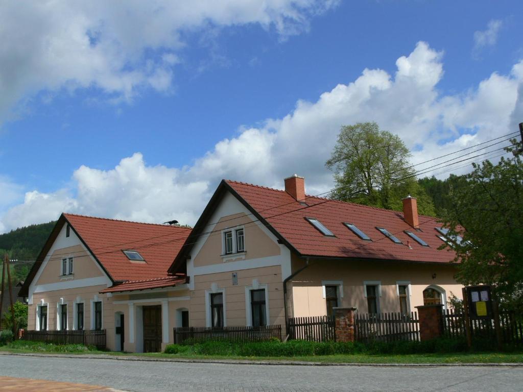 a large house with a red roof at U Pramene Virskeho Vanku in Vír