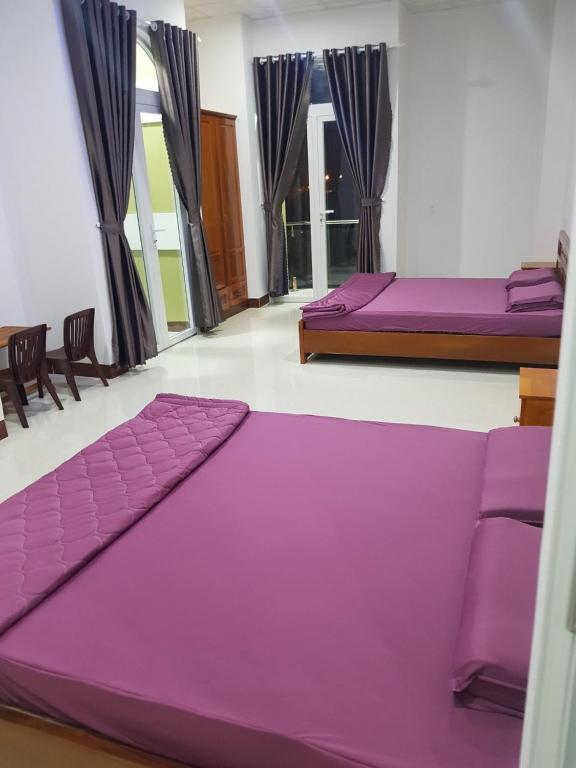 Giường trong phòng chung tại Homestay Hoài Tâm Phan Thiết