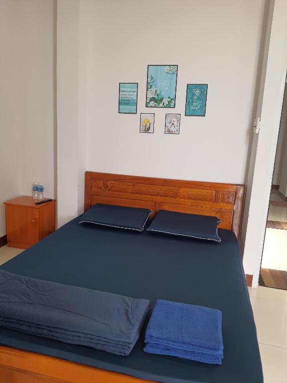 Giường trong phòng chung tại Homestay Hoài Tâm Phan Thiết