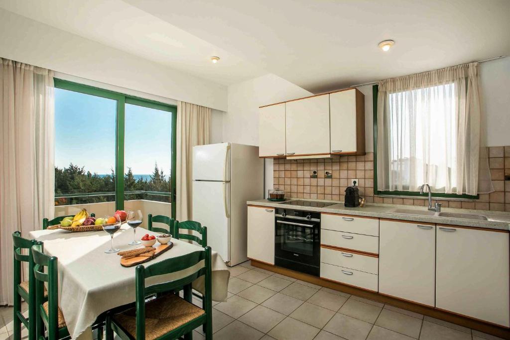 A kitchen or kitchenette at Beachfront Villa SeaShell Superior