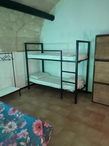 Postel nebo postele na pokoji v ubytování sassi low cost