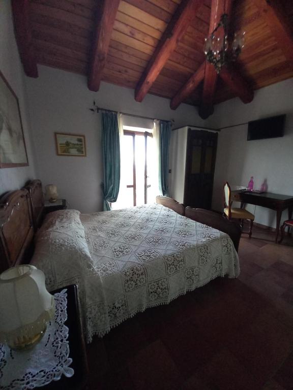 Postel nebo postele na pokoji v ubytování Agriturismo Brusalino