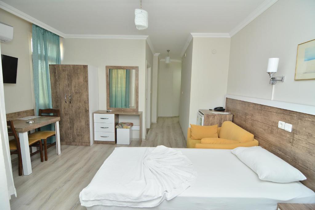 A bed or beds in a room at Cleopatra King Apart