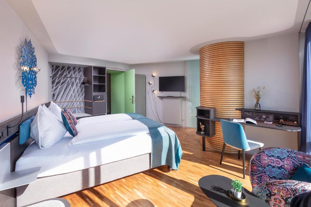 Uma cama ou camas num quarto em Sedartis Swiss Quality Hotel