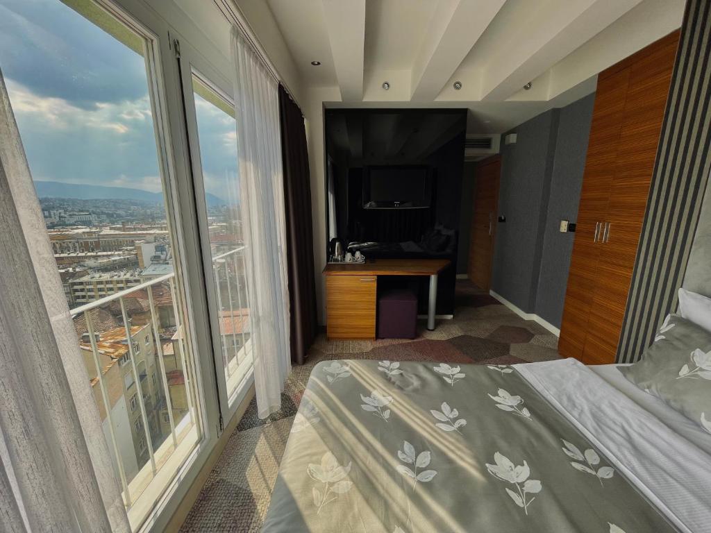 Postel nebo postele na pokoji v ubytování Hotel City View Deluxe