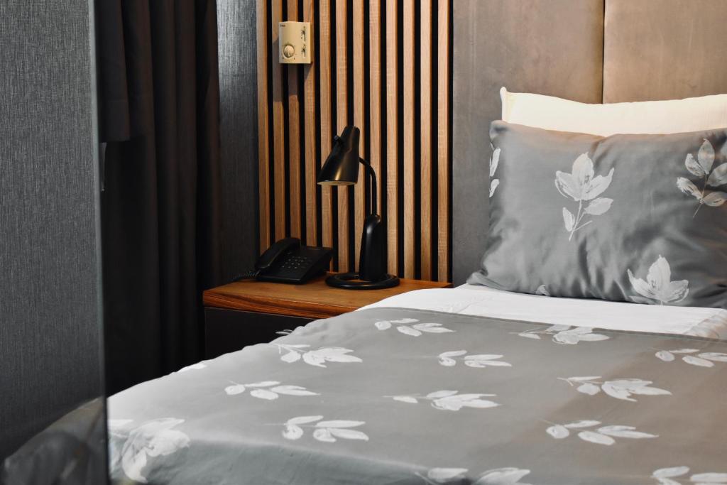 Postel nebo postele na pokoji v ubytování Hotel City View Deluxe