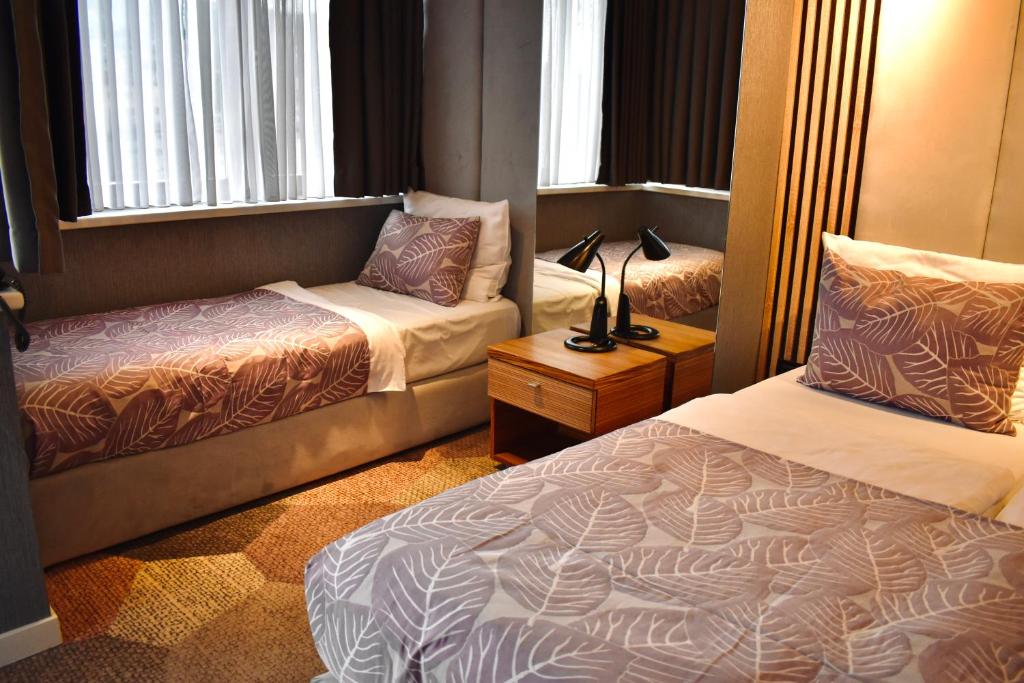 Postel nebo postele na pokoji v ubytování Hotel City View Deluxe