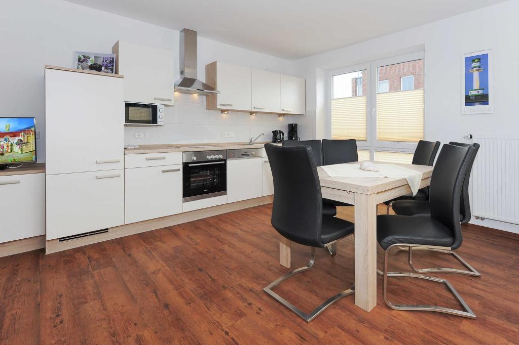 Kuchyň nebo kuchyňský kout v ubytování Haus Leuchtturm