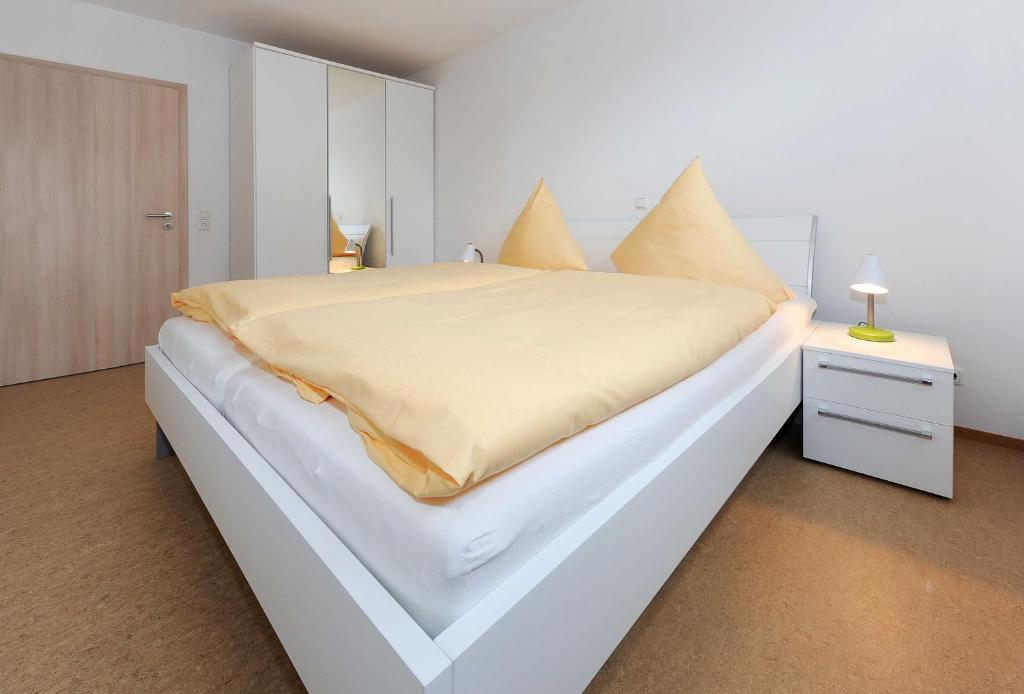 Postel nebo postele na pokoji v ubytování Haus Leuchtturm
