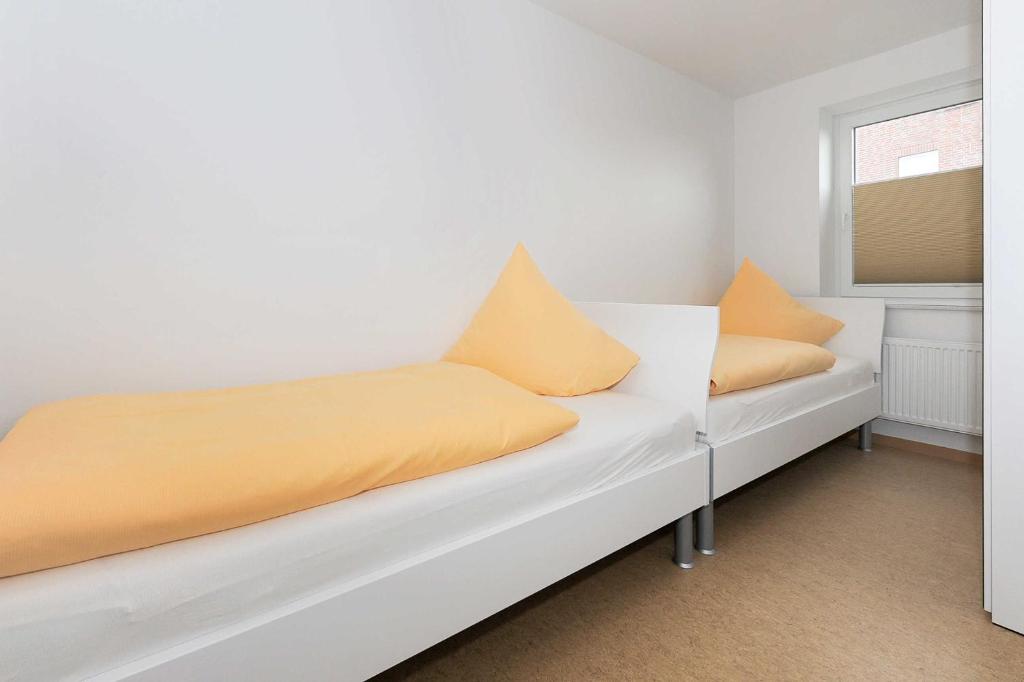 Postel nebo postele na pokoji v ubytování Haus Leuchtturm