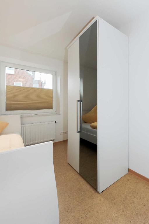 Postel nebo postele na pokoji v ubytování Haus Leuchtturm