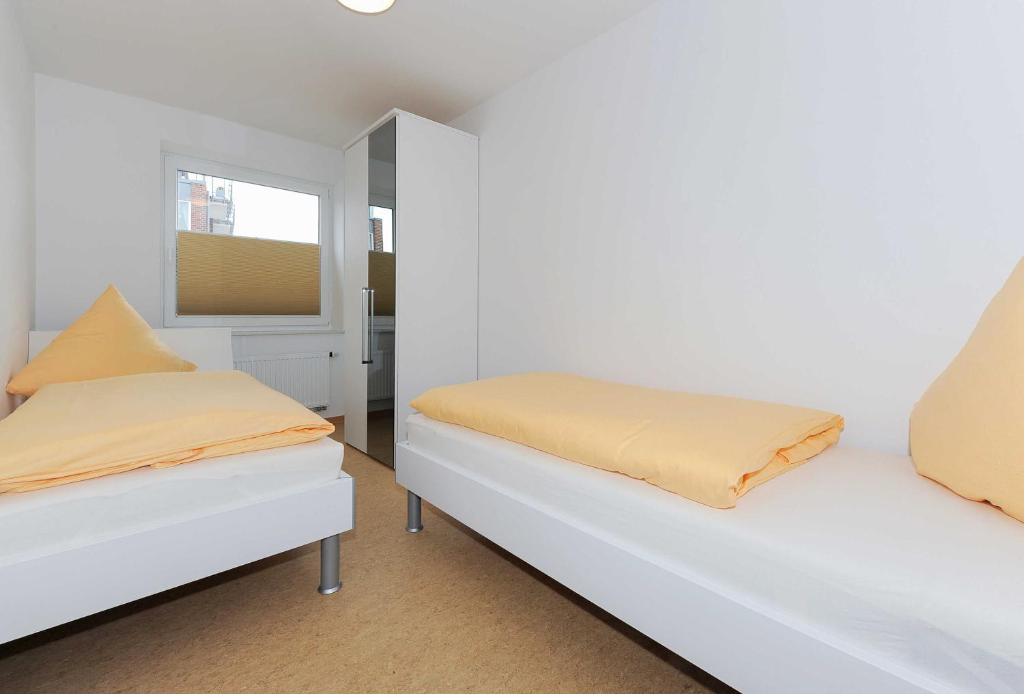Postel nebo postele na pokoji v ubytování Haus Leuchtturm