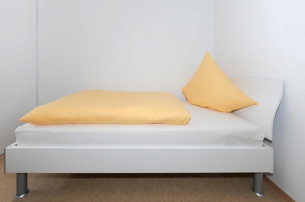 Postel nebo postele na pokoji v ubytování Haus Leuchtturm