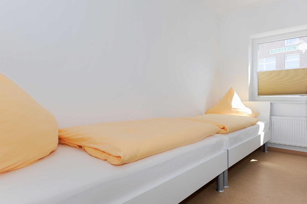 Postel nebo postele na pokoji v ubytování Haus Leuchtturm