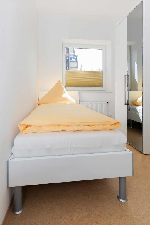 Postel nebo postele na pokoji v ubytování Haus Leuchtturm