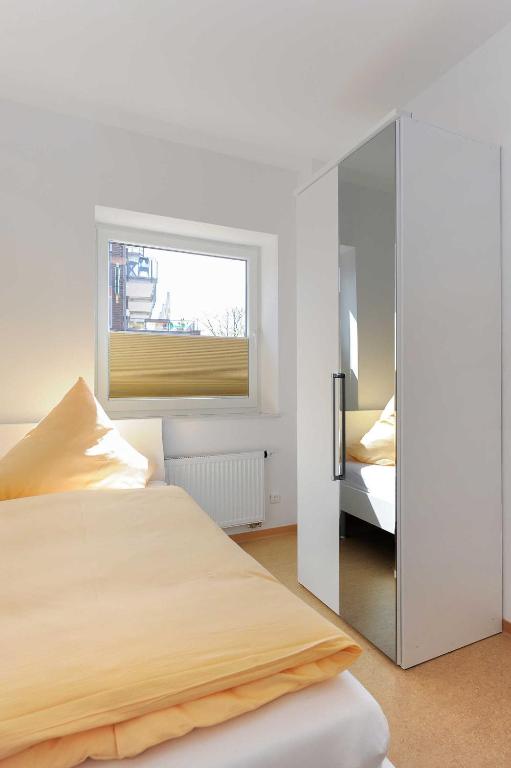 Postel nebo postele na pokoji v ubytování Haus Leuchtturm