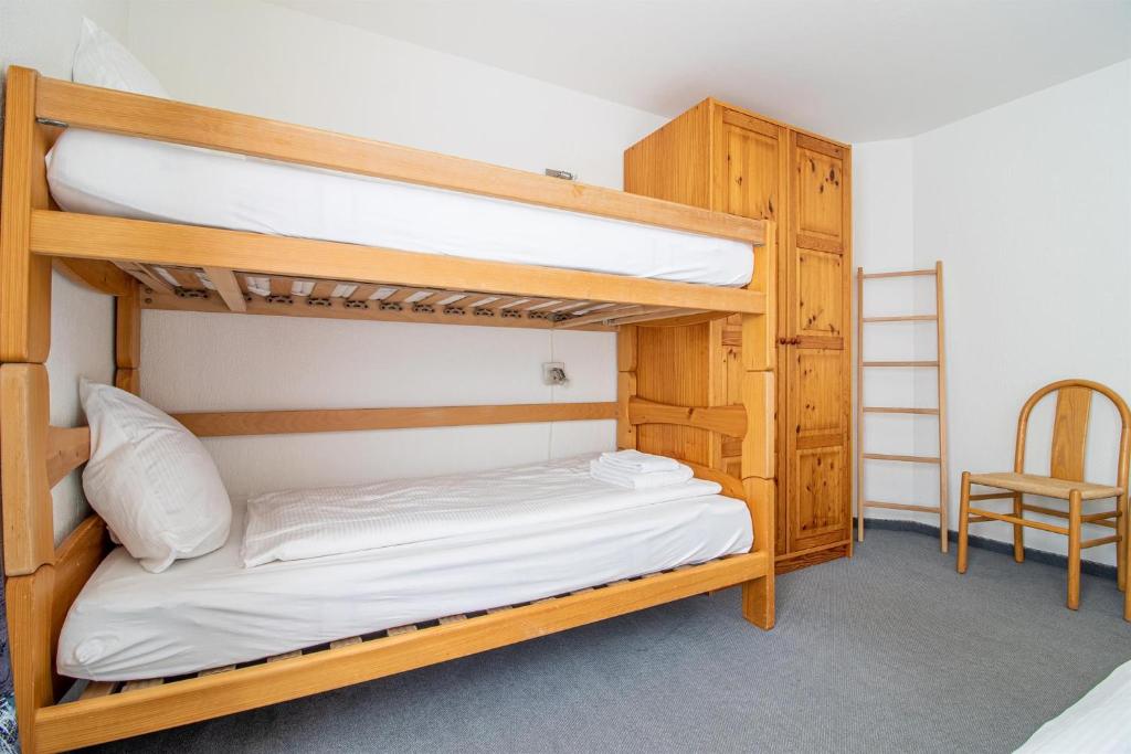 Postel nebo postele na pokoji v ubytování Camana Wohnung EG
