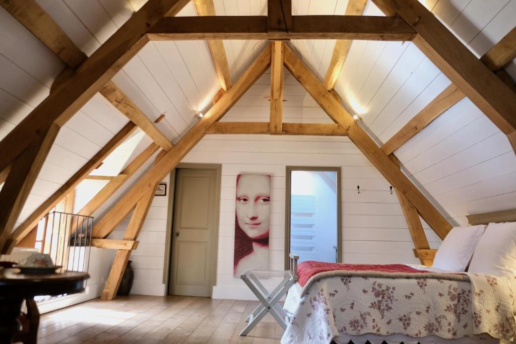 Postel nebo postele na pokoji v ubytování Manoir de l'Isle