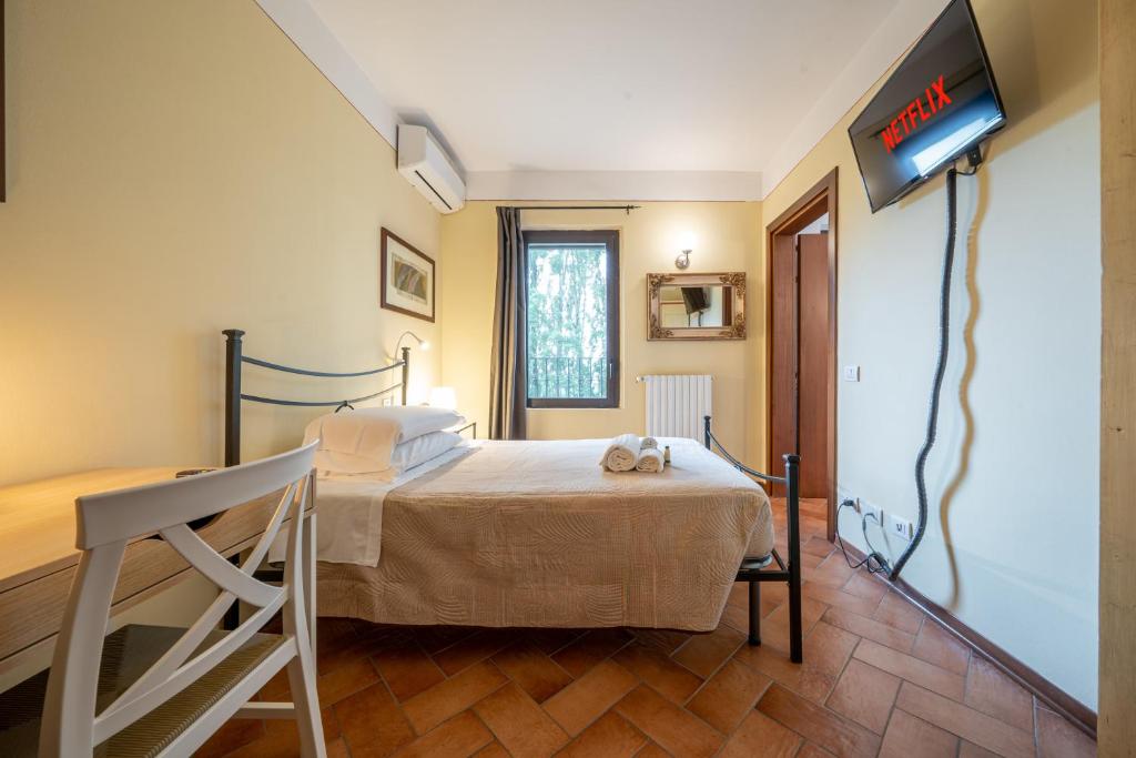 Postel nebo postele na pokoji v ubytování Casello A1, Modena sud - Villa Aurora Charming Rooms